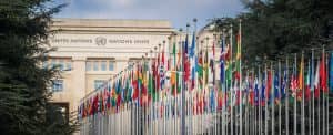 Geneva, Switzerland - December 03, 2019: Palace of Nations and Country flags - United Nations Office - Geneva, Switzerland