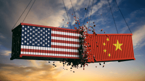 A clash of two geopolitical systems shown as flags on box cars